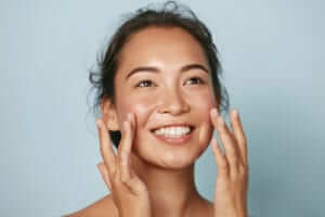 Woman washing her face